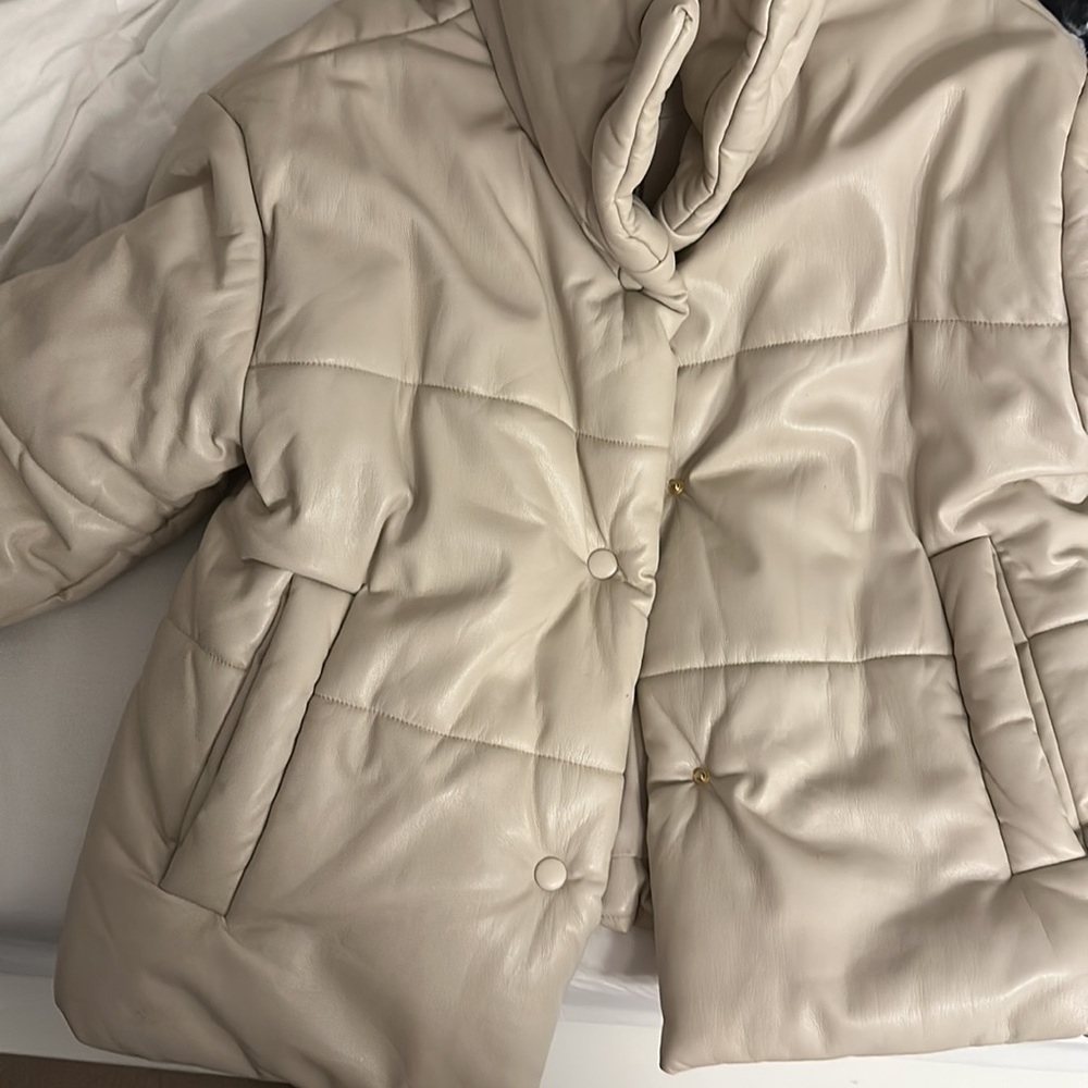 Nanushka puffer wore with some stains